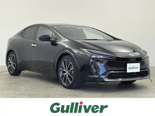 トヨタ プリウス Z 千葉県 2024(令6)年 0.5万km アティチュードブラックマイカ セーフティセンス（予防安全パッケージ）/・プリクラッシュセーフティ/・フロントクロストラフィックアラート/・レーントレーシングアシスト/・レーダークルーズコントロール/・ロードサインアシスト/・ドライバー異常時対応システム/・プロアクティブドライビングアシスト/・発進遅れ告知機能/・緊急時操舵支援/・レーンチェンジアシスト/・レーンディパーチャーアラート/・オートマチックハイビーム/12.3インチディスプレイオーディオ/・コネクティッドナビ対応 12.3インチHDディスプレイ/・地デジTV/・AM/FMラジオ/・USBタイプC入力/・Apple CarPlay / Android Auto/パノラマルーフ/純正19インチAW/メモリー付きパワーシート/LEDヘッドライト/AC100V/ETC2.0