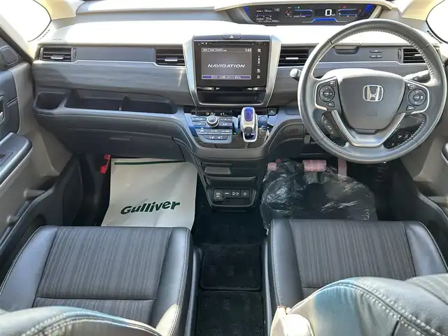 ホンダ フリード＋ ハイブリット EX 佐賀県 2016(平28)年 7.9万km ホワイトオーキッドパール ワンオーナー/純正7型ワイドナビ(フルセグTV/AM/FM/BT/USB/HDMI)/ホンダセンシング/衝突軽減ブレーキ/誤発進抑制/アダプティブクルーズコントロール/車線維持支援/歩行者事故低減ステアリング/先行者発進お知らせ/標識認識/バックカメラ/両側パワースライドドア/ビルトインETC/ハーフレザーシート(合皮)/シートヒーター(D/N席)/ロールサンシェード(2列目)/LEDヘッドライト/フォグランプ/フロントワイパーデアイサー/Moduloサイドエアロ/現状サマー(純正AW)(185/65/R15)/社外15インチアルミ4本積込(スタッドレス付)/スマートキー×2本/保証書、取扱説明書/DUNLOP ENASAVE RV505/BRIDGESTONE BLIZAK VRX2