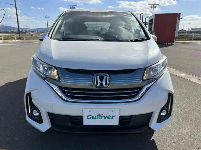 ホンダ フリード＋ ハイブリット EX 佐賀県 2016(平28)年 7.9万km ホワイトオーキッドパール ワンオーナー/純正7型ワイドナビ(フルセグTV/AM/FM/BT/USB/HDMI)/ホンダセンシング/衝突軽減ブレーキ/誤発進抑制/アダプティブクルーズコントロール/車線維持支援/歩行者事故低減ステアリング/先行者発進お知らせ/標識認識/バックカメラ/両側パワースライドドア/ビルトインETC/ハーフレザーシート(合皮)/シートヒーター(D/N席)/ロールサンシェード(2列目)/LEDヘッドライト/フォグランプ/フロントワイパーデアイサー/Moduloサイドエアロ/現状サマー(純正AW)(185/65/R15)/社外15インチアルミ4本積込(スタッドレス付)/スマートキー×2本/保証書、取扱説明書/DUNLOP ENASAVE RV505/BRIDGESTONE BLIZAK VRX2