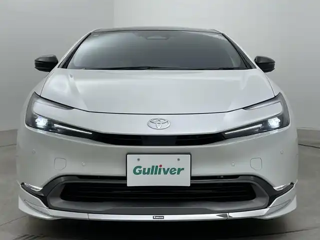トヨタ プリウス Z 岡山県 2025(令7)年 0.9万km プラチナホワイトパールマイカ ガラスルーフ/モデリスタフルエアロ/純正12.3インチナビ /地デジ/BT/AppleCarPlay/USB/パノラミックビューモニター/ビルトインETC2.0/黒合皮シート/シートヒーター /ベンチレーション/レーダークルーズコントロール/ステアリングヒーター/BSM/デジタルインナーミラー/純正前後ドラレコ /シートメモリー/純正フロアマット/LEDヘッドライト