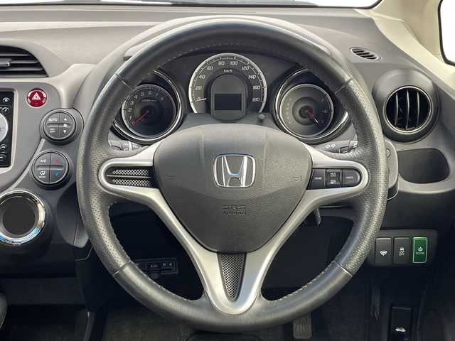 ホンダ フィット XH 新潟県 2013(平25)年 8万km ポリッシュドメタルメタリック 純正カーオーディオ/ステアリングスイッチ/ワイパーデアイサー/シートヒーター/ドアバイザー/ウィンカーミラー/電格ミラー/クルーズコントロール/純正フロアマット/ETC