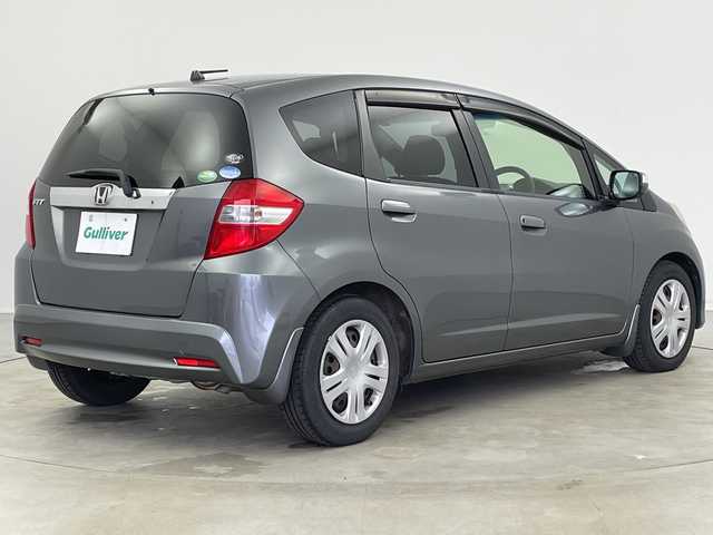 ホンダ フィット XH 新潟県 2013(平25)年 8万km ポリッシュドメタルメタリック 純正カーオーディオ/ステアリングスイッチ/ワイパーデアイサー/シートヒーター/ドアバイザー/ウィンカーミラー/電格ミラー/クルーズコントロール/純正フロアマット/ETC