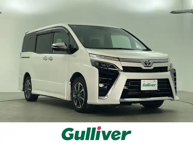 トヨタ ヴォクシー ZS 煌Ⅲ 福井県 2021(令3)年 6.2万km ホワイトパールクリスタルシャイン 純正10インチナビゲーション/【AM/FM/CD/Bluetooth/フルセグTV】/純正フリップダウンモニター/バックカメラ/ビルトインETC/両側パワースライドドア/トヨタセーフティセンス/・衝突軽減ブレーキ/・車線逸脱警報機能/・クルーズコントロール（追従なし）/プッシュスタート/スマートキー/オートライト/LEDヘッドライド/LEDフォグランプ