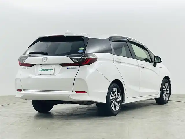 ホンダ シャトル ハイブリッド ホンダセンシング 福島県 2019(令1)年 3.9万km プラチナホワイトパール ホンダセンシング/・衝突軽減ブレーキ〈CMBS〉/・誤発進抑制機能/・ACC〈アダプティブ・クルーズ・コントロール〉/・LKAS〈車線維持支援システム〉/・先行車発進お知らせ機能/純正メモリナビ/型番：VXM-204VFi/・AM/FM/CD/DVD/BT/フルセグTV/・バックカメラ/・ビルトインETC/・前後ドライブレコーダー/プッシュスタート/・スマートキー/・スペアキー/チルト式ステアリング/・ステアリングスイッチ/ウインカーミラー/純正フロアマット