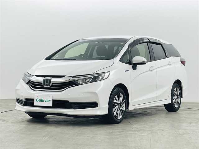 ホンダ シャトル ハイブリッド ホンダセンシング 福島県 2019(令1)年 3.9万km プラチナホワイトパール ホンダセンシング/・衝突軽減ブレーキ〈CMBS〉/・誤発進抑制機能/・ACC〈アダプティブ・クルーズ・コントロール〉/・LKAS〈車線維持支援システム〉/・先行車発進お知らせ機能/純正メモリナビ/型番：VXM-204VFi/・AM/FM/CD/DVD/BT/フルセグTV/・バックカメラ/・ビルトインETC/・前後ドライブレコーダー/プッシュスタート/・スマートキー/・スペアキー/チルト式ステアリング/・ステアリングスイッチ/ウインカーミラー/純正フロアマット