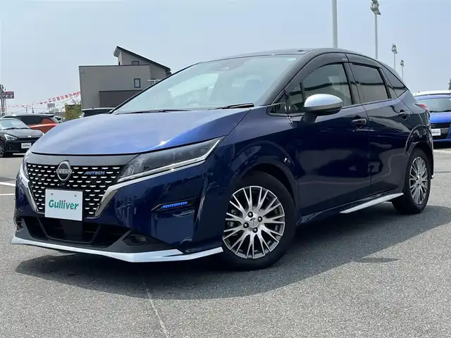 日産 ノート オーテック 奈良県 2021(令3)年 2万km オーロラフレアブルーパール /スーパーブラック 2トーン 純正ナビ(フルセグTV/CD/AM・FM/BT)/バックカメラ/ビルトインETC2.0/前方ドラレコ/衝突被害軽減ブレーキ/車線逸脱警報/VDC(ビークルダイナミクスコントロール)/オートブレーキホールド/LEDヘッドランプ/フォグランプ/純正16インチアルミホイール/本革巻きステアリング/レザレットシート/純正フロアマット/スペアキー