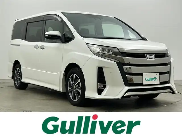 トヨタ ノア Si ダブルバイビーⅡ 岡山県 2019(令1)年 5.1万km ホワイトパールクリスタルシャイン 純正10インチナビ（NSZN-Z68T）/・FM/AM/Bluetooth/フルセグ/CD/DVD/バックカメラ/12.1インチフリップダウンモニター/両側電動スライドドア/ハーフレザーシート/ドライブレコーダー/ビルトインETC2.0/トヨタセーフティーセンス/・プリクラッシュセーフティ/・レーンキープアシスト/・レーダークルーズコントロール/・オートマチックハイビーム/LEDヘッドライト/・フォグライト/純正16インチアルミ/フロアマット
