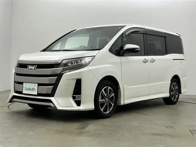 トヨタ ノア Si ダブルバイビーⅡ 岡山県 2019(令1)年 5.1万km ホワイトパールクリスタルシャイン 純正10インチナビ（NSZN-Z68T）/・FM/AM/Bluetooth/フルセグ/CD/DVD/バックカメラ/12.1インチフリップダウンモニター/両側電動スライドドア/ハーフレザーシート/ドライブレコーダー/ビルトインETC2.0/トヨタセーフティーセンス/・プリクラッシュセーフティ/・レーンキープアシスト/・レーダークルーズコントロール/・オートマチックハイビーム/LEDヘッドライト/・フォグライト/純正16インチアルミ/フロアマット