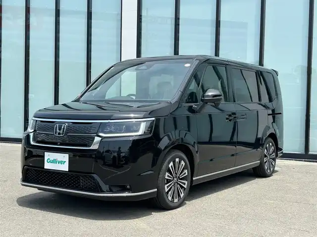 ホンダ ステップワゴン スパーダ eHEV プレミアムライン 大阪府 2025(令7)年 0.1万km未満 クリスタルブラックパール 衝突軽減ブレーキ/ブラインドスポットモニター/横滑り防止装置/レーンキープアシスト/シートヒーター（1列目、2列目）/両側パワースライドドア/レーダークルーズコントロール/パドルシフト/電動リアゲート/オットマン/ハーフレザーシート/プッシュスタート/スマートキー/ＬＥＤライト/純正17インチアルミホイール/禁煙車
