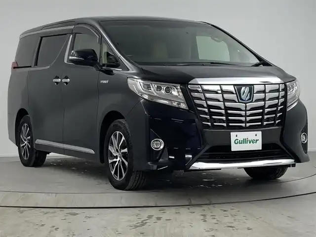 トヨタ アルファードハイブリット エグゼクティブ ラウンジ 熊本県 2016(平28)年 5万km ブラック 登録時走行距離49.159km/純正ナビ/(AM/FM/SD/TV/Bluetooth)/純正12.1インチフリップダウンモニター/パノラミックビューモニター/JBLプレミアムサウンドシステム/インテリジェントクリアランスソナー/トヨタセーフティセンス/・プリクラッシュセーフティ/・レーンディパーチャーアラート/・アダプティブクルーズコントロール/・オートマチックハイビーム/シートメモリー/シートヒーター/ステアリングヒーター/両側パワースライドドア/4WD/プッシュスタート/スマートキー