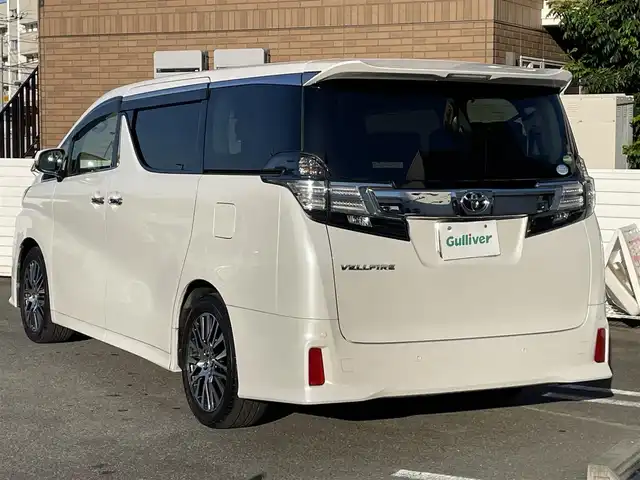 トヨタ ヴェルファイア Z Gエディション 群馬県 2015(平27)年 6.6万km ホワイトパールクリスタルシャイン ワンオーナー/純正メモリーナビ　/　CD/DVD/Bluetooth/フルセグＴＶ/バックカメラ/純正フリップダウンモニター/運転席メモリー機能付きパワーシート/助手席オットマン付きパワーシート/セカンドシートオットマン/両側パワースライドドア/パワーバックドア/ステアリングヒーター/クルーズコントロール/ビルトインＥＴＣ/電動格納ミラー/ＬＥＤヘッドライト/フォグランプ/ウッドコンビステア/クリアランスソナー/保証書/取説/スペアキーｘ１/社外アルミスタッドレスタイヤ積み込み