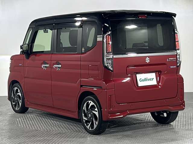 スズキ スペーシア カスタム HYBRID XS ターボ 沖縄県 2024(令6)年 1.7万km フェニックスレッドパール/ブルーイッシュブラックパール 禁煙車　/純正９インチナビ　/BT/フルセグTV/ラジオ/カープレイ/全方位カメラ　/社外ドライブレコーダー　/レーダークルーズコントロール/ステアリングヒーター　/オートホールド/ヘッドアップディスプレイ　/レザーシートカバー　/シートヒーター　/オットマン　/両側パワースライドドア　/衝突軽減　/前後コーナーセンサー/純正LEDヘッドライト