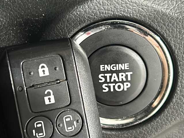 スズキ スペーシア カスタム HYBRID XS ターボ 沖縄県 2024(令6)年 1.7万km フェニックスレッドパール/ブルーイッシュブラックパール 禁煙車　/純正９インチナビ　/BT/フルセグTV/ラジオ/カープレイ/全方位カメラ　/社外ドライブレコーダー　/レーダークルーズコントロール/ステアリングヒーター　/オートホールド/ヘッドアップディスプレイ　/レザーシートカバー　/シートヒーター　/オットマン　/両側パワースライドドア　/衝突軽減　/前後コーナーセンサー/純正LEDヘッドライト