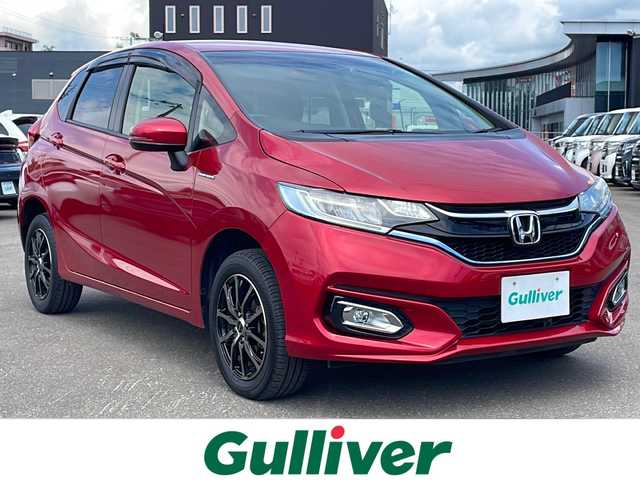 ホンダ フィット ハイブリット F 道東・釧路十勝 2017(平29)年 8.8万km プレミアムクリスタルレッドM 4WD/寒冷地仕様/ナビ　/　(AM/FM/CD/DVD/BT)/ビルトインETC/バックカメラ/社外15インチAW/純正フロアマット/ドアバイザー/アイドリングストップ/コーナーセンサー/オートライト/ライトレベライザー/フォグランプ/盗難防止装置/ABS/横滑り防止装置