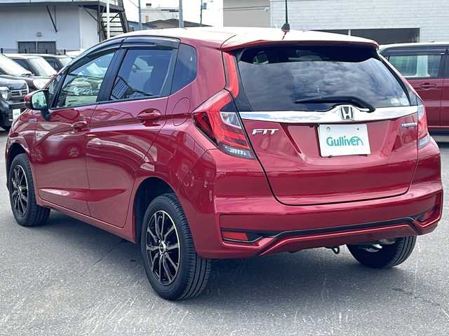 ホンダ フィット ハイブリット F 道東・釧路十勝 2017(平29)年 8.8万km プレミアムクリスタルレッドM 4WD/寒冷地仕様/ナビ　/　(AM/FM/CD/DVD/BT)/ビルトインETC/バックカメラ/社外15インチAW/純正フロアマット/ドアバイザー/アイドリングストップ/コーナーセンサー/オートライト/ライトレベライザー/フォグランプ/盗難防止装置/ABS/横滑り防止装置