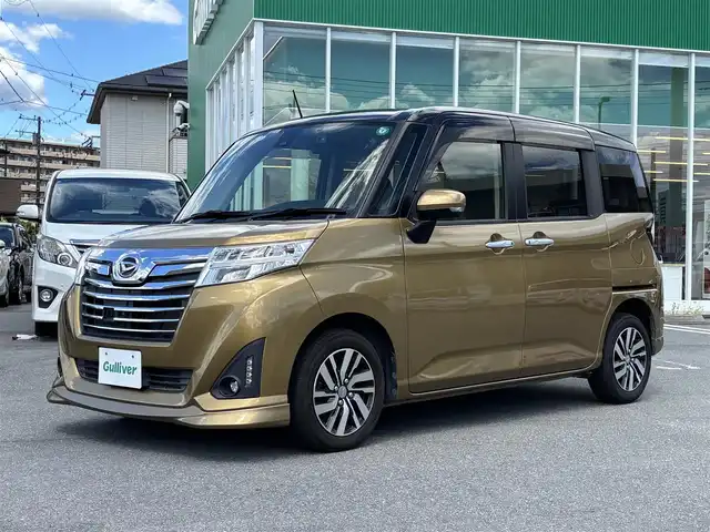 ダイハツ トール カスタムG SAⅡ 静岡県 2016(平28)年 2.6万km ブラックマイカメタリック/インペリアルゴールドクリスタルメタリック エンジンスタートボタン/パワーステアリング/パワーウィンドウ/アイドリングストップ/スマートキー/オートエアコン/クルーズコントロール/純正フリップダウンモニター/9インチナビ（CD/DVD/BT/フルセグ）/全方位カメラ/ETC/ドライブレコーダー前後/ウォークスルー/純正フロアマット/純正アルミホイール/ABS/横滑り防止装置/コーナーセンサー/レーンキープアシスト/オートライト/LEDヘッドライト/Wエアバック/衝突軽減システム