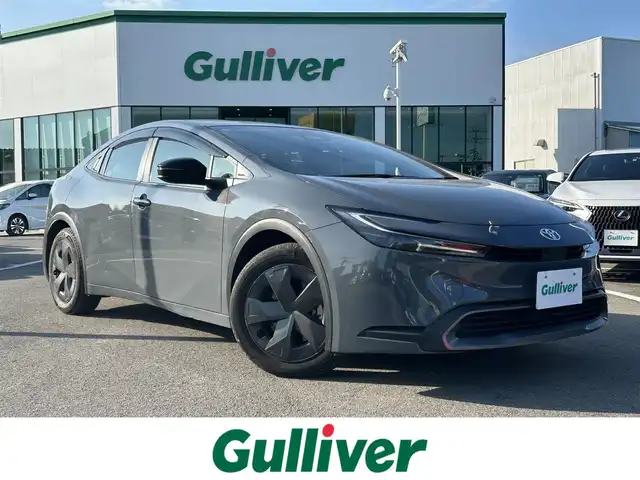 トヨタ プリウス U 愛媛県 2023(令5)年 2.1万km グレー 4WD/寒冷地仕様/純正8型ナビ/フルセグTV/パノラミックビューモニター/ビルトインETC2.0/純正ドライブレコーダー/レーダークルーズコントロール/クリアランスソナー/セーフティセンス/・衝突被害軽減ブレーキ/・車線逸脱防止支援システム/・ドライバー異常時対応システム/・オートマチックハイビーム/緊急時操舵支援/ブラインドスポットモニター/レーンチェンジアシスト/パーキングサポートブレーキ/LEDヘッドランプ/合皮巻きステアリング/ステアリングヒーター/上級ファブリックスポーティシート/前席シートヒーター/スマートキー/プッシュエンジンスタート/禁煙車