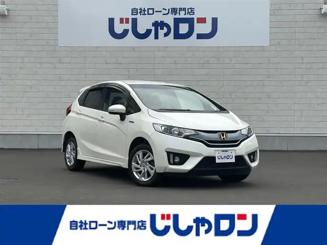 ホンダ フィット ハイブリット Sパッケージ 道北・旭川 2014(平26)年 8.1万km プレミアムホワイトパール (株)IDOMが運営する【じしゃロン旭川店】の自社ローン専用車両になります。こちらは現金またはオートローンご利用時の価格です。自社ローンご希望の方は別途その旨お申付け下さい/　/・純正ナビ(CD/DVD/BT/フルセグ)/・バックカメラ/・ETC/・クルーズコントロール/・パドルシフト/・ステアリングリモコン/・プッシュスタート/・スマートキー２個/・フォグランプ/・取扱説明書