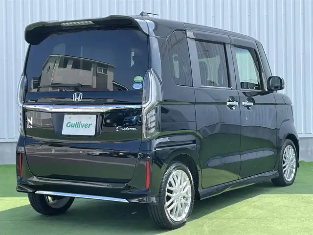 ホンダ Ｎ ＢＯＸ カスタム L ターボ 香川県 2021(令3)年 4.9万km クリスタルブラックパール 登録時走行距離；48629km/社外ナビ/バックカメラ/ETC/ドライブレコーダー/両側パワースライドドア/衝突被害軽減システム/レーンキープアシスト/クルーズコントロール/クリアランスソナー/パドルシフト/LEDヘッドライト/純正フロアマット/純正AW15インチ/革巻きステアリング/ステアリングスイッチ/シートヒーター/スマートキー