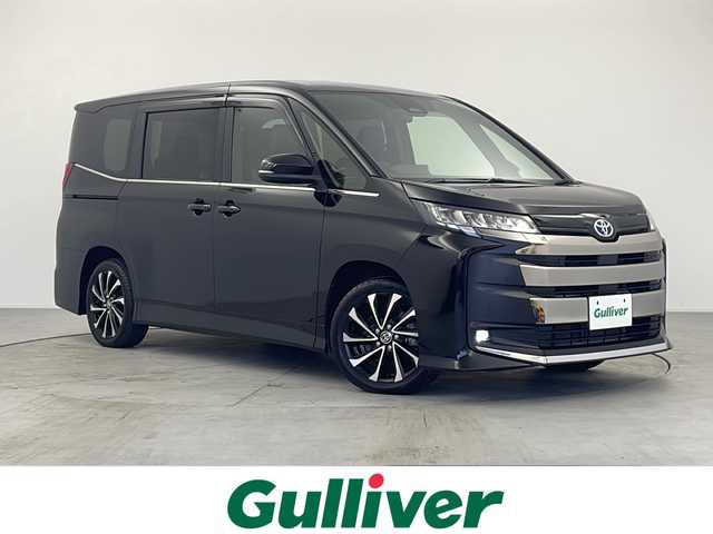 トヨタ ノア ハイブリッド S－Z 愛知県 2022(令4)年 5.1万km アティチュードブラックマイカ 純正10.5型メモリナビ/フルセグTV/BT/HDMI/USB//AppleCarPlaｙ/AndroidAuto/CD/DVDキット/快適利便high/2列目席オットマン機能/2列目席シートヒーター/ハンドルヒーター/パワーバックドア/両側電動スライドドア/ビルトインETC2.0/ハーフレザーシート/シートヒーター　D/N席/AC100V/トヨタセーフティセンス/PCS/LDA/ACC/PKSB//RSA/AHB/PDA/先行車発進告知/クリアランスソナー/スマートキー/プッシュスタート/革巻きステアリング/ステアリングスイッチ/LEDオートライト/フォグランプ/USBポート/サンシェード/電動パーキング/オートブレーキホールド/nanoeX/純正17インチAW/純正フロアマット/純正ドアバイザー