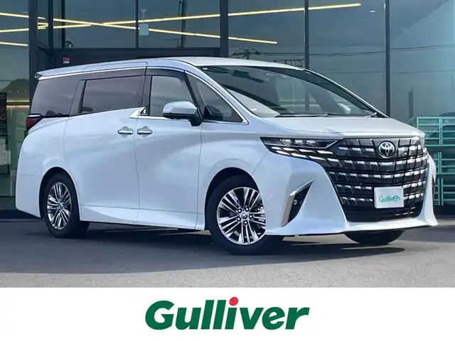トヨタ アルファードハイブリット Z 東京都 2024(令6)年 1.7万km プラチナホワイトパールマイカ 左右独立ムーンルーフ/ユニバーサルステップ/モデリスタ マルチカラーインテリアイルミネーション/Toyota Safety Sense/・プリクラッシュセーフティ/・レーントレーシングアシスト/・先行車発進告知機能/・オートマチックハイビーム/・レーダークルーズコントロール/・クリアランスソナー/・ブラインドスポットモニター/・ヘッドアップディスプレイ/パノラミックビューモニター/アドバンスドパーク/デジタルインナーミラー/ワイヤレス充電器/100V電源/ETC2.0/前後ドライブレコーダー HDR361GW/パドルシフト/純正ナビ/フルセグTV/両側パワースライドドア/パワーバックドア/レザーシート/パワーシート/運転席シートメモリー機能/オットマン/シートヒーター/ベンチレーション/ステアリングヒーター/LEDヘッドライト/ドアバイザー/18インチ純正アルミホイール/スマートキー