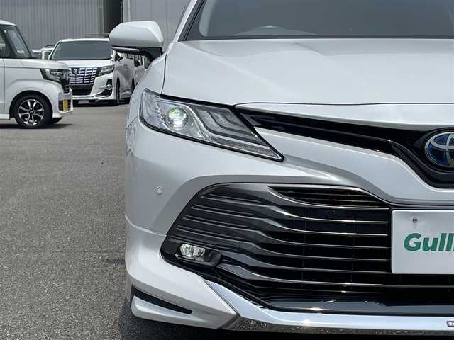 トヨタ カムリ G 宮崎県 2020(令2)年 6.1万km プラチナホワイトパールマイカ 純正ディスプレイオーディオ/フルセグTV/TVキャンセラー/バックカメラ/ステアリングスイッチ/レーダークルーズコントロール/横滑り防止機能/オートハイビーム/D席パワーシート/前後ドライブレコーダー/クリアランスソナー/ブラインドスポットモニタ/車線逸脱警報/モデリスタフルエアロ/ビルトインETC