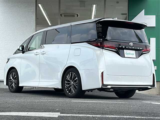 トヨタ ヴェルファイア Z プレミア 愛知県 2023(令5)年 0.9万km プラチナホワイトパールマイカ ワンオーナー/禁煙車/左右独立ムーンルーフ/純正メーカーナビ/【フルセグTV/Bluetooth】/パノラミックビューモニター/デジタルインナーミラー/両側パワースライドドア/レーダークルーズコントロール/衝突被害軽減システム/ブラインドスポットモニター/パーキングサポートブレーキ/リアカメラディテクション安心降車アシスト/クリアランスソナー/レーンキープアシスト/レーンチェンジアシスト/ロードサインアシスト/プロアクティブドライビングアシスト/フロントクロストラフィックアラート/リアクロストラフィックアラート/後方車両接近装置/純正19インチAW/オートライト/LEDヘッドライト/茶レザーシート/パワーシート（メモリ付き）/シートヒーター/エアシート/後部座席オットマン/キャプテンシート/ETC2.0/スペアキー１/保証書/取扱説明書/記録簿R６
