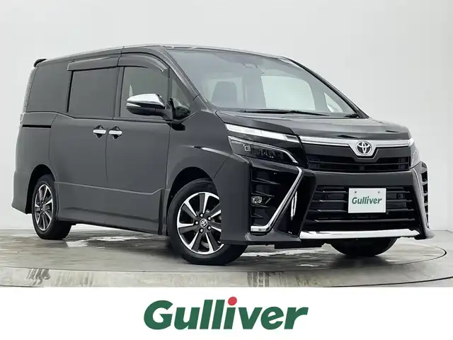 トヨタ ヴォクシー ZS 煌Ⅱ 宮城県 2020(令2)年 3.7万km ブラック 純正９型ナビ　/１２型フリップダウンモニター　/両側パワースライドドア　/プリクラッシュセーフティシステム　/レーンディパーチャーアラート/オートマチックハイビーム　/クリアランスソナー　/バックモニター/ＥＴＣ　/前後ドライブレコーダー　/後席エアコン/リアサンシェード/フルセグTV/CD/DVD/Bluetooth/充電用USBポート/LEDヘッドランプ/フォグランプ/純正16インチAW/禁煙車