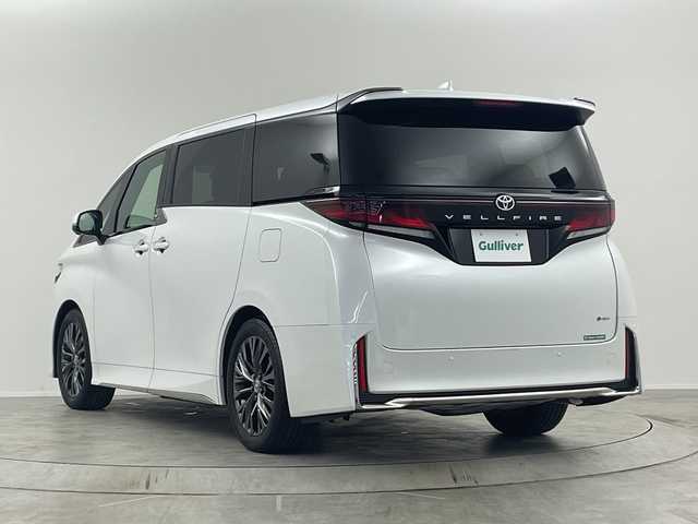 トヨタ ヴェルファイア ハイブリット Z プレミア 埼玉県 2023(令5)年 1.1万km プラチナホワイトパールマイカ サンルーフ/純正１４型ディスプレイオーディオ/ユニバーサルステップ/ベージュレザーシート/ワイヤレス充電/フルセグTV/360°カメラ/ブラインドスポットモニター/ヘッドアップディスプレイ/ＬＥＤヘッドライト/ビルトインＥＴＣ２．０/両側パワースライドドア/トヨタセーフティセンス/デジタルインナーミラー/シートヒーター・エアシート(D・N・2nd)/3列シート・オットマン・フルフラットシート/ウォークスルー/パワーシート/パワーバックドア/Bluetooth・HDMI/純正19インチアルミホイール/100V電源・1500W電源/MTモード付AT/Wエアコン/ステアリングヒーター/衝突被害軽減/スマートキー・プッシュスタート/パーキングアシスト/アイドリングストップ