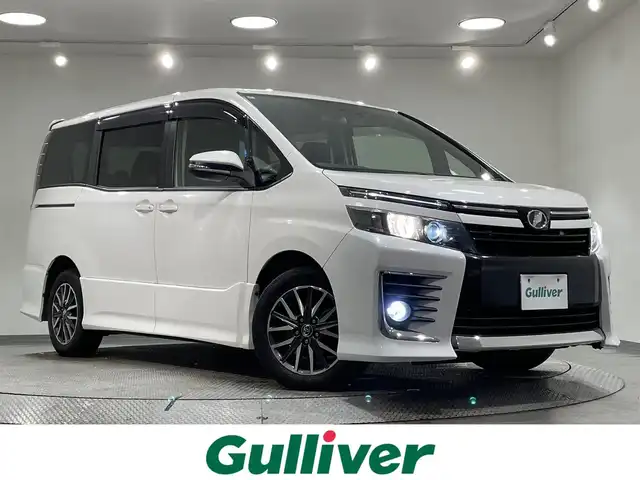 トヨタ ヴォクシー ZS 愛知県 2014(平26)年 5.4万km ホワイトパールクリスタルシャイン 純正９インチナビ/両側パワースライドドア/ドライブレコーダー/ビルトインＥＴＣ/バックカメラ/Ｂｌｕｅｔｏｏｔｈ/ＣＤ／ＤＶＤ/フルセグＴＶ/アイドリングストップ/純正１６インチアルミホイール/純正フロアマット/オートライト