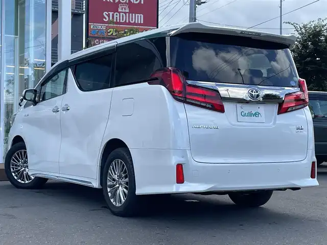 トヨタ アルファードハイブリット S タイプゴールド 道央・札幌 2021(令3)年 9.6万km ホワイトパールクリスタルシャイン ・4WD/・衝突軽減ブレーキ/・寒冷地仕様/・両側パワースライドドア/・純正ナビ/CD&DVD&BT&フルセグTV&AppleCarPlay/・キャンセラー/・ハンズフリー/・フリップダウンモニター(リモコン付)/・バックカメラ/・コーナーセンサー/・レーンキープアシスト/・レーダークルーズコントロール(追従走行あり)/・横滑り防止装置/・WAC/・前席バニティミラー(両側ライト付)/・ウォークスルー/・2列目両側オットマン/・USB入力端子/・1列目2列目100V充電/・プッシュスタート/・スマートキー/・ワイパー熱線/・前方純正ドライブレコーダー/・ビルトインETC/・オートライト/・オートマチックハイビーム/・前後コーナーセンサー/・電動格納ミラー/・ウィンカーミラー/・フォグランプ/・純正フロアマット/・ドアバイザー/・積込17インチ冬タイヤ