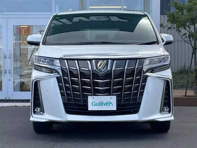 トヨタ アルファードハイブリット S タイプゴールド 道央・札幌 2021(令3)年 9.6万km ホワイトパールクリスタルシャイン ・4WD/・衝突軽減ブレーキ/・寒冷地仕様/・両側パワースライドドア/・純正ナビ/CD&DVD&BT&フルセグTV&AppleCarPlay/・キャンセラー/・ハンズフリー/・フリップダウンモニター(リモコン付)/・バックカメラ/・コーナーセンサー/・レーンキープアシスト/・レーダークルーズコントロール(追従走行あり)/・横滑り防止装置/・WAC/・前席バニティミラー(両側ライト付)/・ウォークスルー/・2列目両側オットマン/・USB入力端子/・1列目2列目100V充電/・プッシュスタート/・スマートキー/・ワイパー熱線/・前方純正ドライブレコーダー/・ビルトインETC/・オートライト/・オートマチックハイビーム/・前後コーナーセンサー/・電動格納ミラー/・ウィンカーミラー/・フォグランプ/・純正フロアマット/・ドアバイザー/・積込17インチ冬タイヤ
