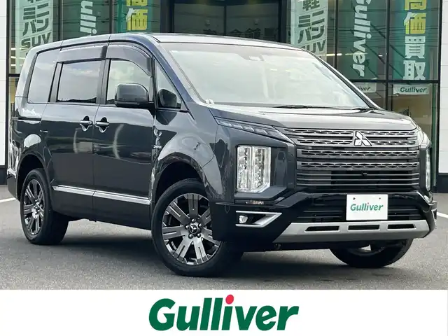 三菱 デリカＤ：５ ジャスパー 岡山県 2023(令5)年 1.5万km グラファイトグレーメタリック/ブラックマイカ 登録時走行距離14240km/純正10.1インチナビ/フルセグTV(AM.FM.CD.DVD.TV.BT)/両側パワースライドドア/全方位カメラ/ETC/ブラインドスポットモニター/ドライブレコーダー/シートヒーター/ブラックレザー調シートカバー/純正ハーフレザーシート/D席パワーシート/衝突軽減ブレーキ/横滑り防止装置/レーダークルーズコントロール/レーンキープアシスト/オートライト/オートマチックハイビーム/アイドリングストップ/電動リアゲート/18インチ純正AW/フロアマット】