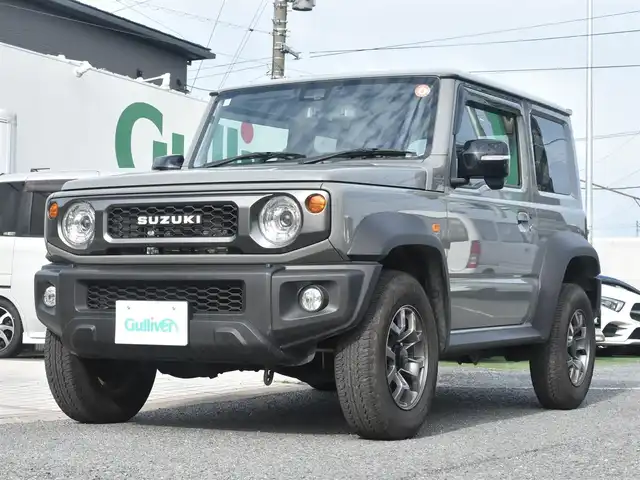 スズキ ジムニー シエラ JC 神奈川県 2024(令6)年 2.1万km ミディアムグレー 社外メモリナビ/フルセグテレビ/バックカメラ/クルーズコントロール/社外ミラー型ドライブレコーダー/ETC/シートカバー/シートヒーター/ETC/LEDヘッドライト/プッシュスタート/スマートキー/保証書/取説/記録(R.6.7)/スペアスマートキー