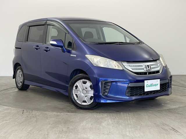 ホンダ フリード ハイブリット ジャストセレクション 兵庫県 2011(平23)年 6.9万km コバルトブルーパール ・純正ナビ/AM/FM/CD/DVD/BT/iPod/TV/・バックカメラ/・クルーズコントロール/・ステアリングリモコン/・純正リアフリップダウンモニター/・パワースライドドア/・ABS/・横滑り防止装置/・ECONモード/・盗難防止装置/・コーナーポール/・前方ドライブレコーダー/・ETC/・ウォークスルー/・ハロゲンオートライト/・オートエアコン/・ウィンカーミラー/・純正フロアマット/・３列シート/・電動格納ミラー/・Wエアバッグ