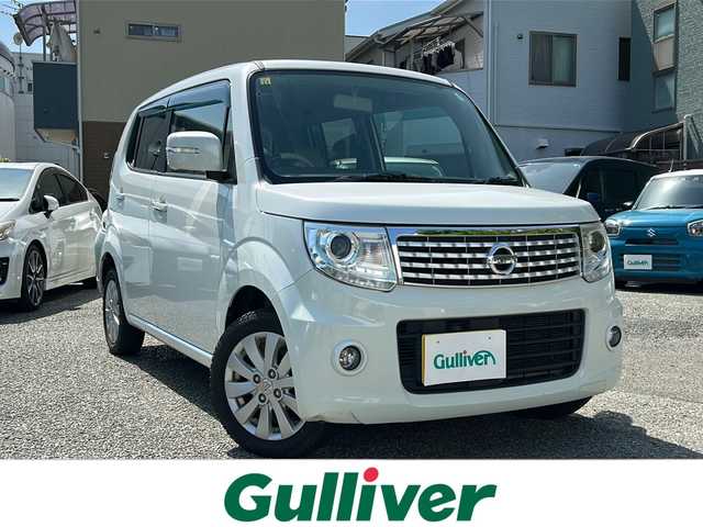 日産 モコ ドルチェX 大阪府 2014(平26)年 10.6万km スノーパールホワイト 純正メモリナビ/・AM/FM/CD/DVD/Bluetooth/・フルセグテレビ/アイドリングストップ/盗難防止装置/オートライト/オートエアコン/プッシュスタートボタン/スマートキー×2/ステアリングリモコン/純正14インチアルミホイール/12V充電器/純正フロアマット/ドアバイザー/保証書/取扱説明書
