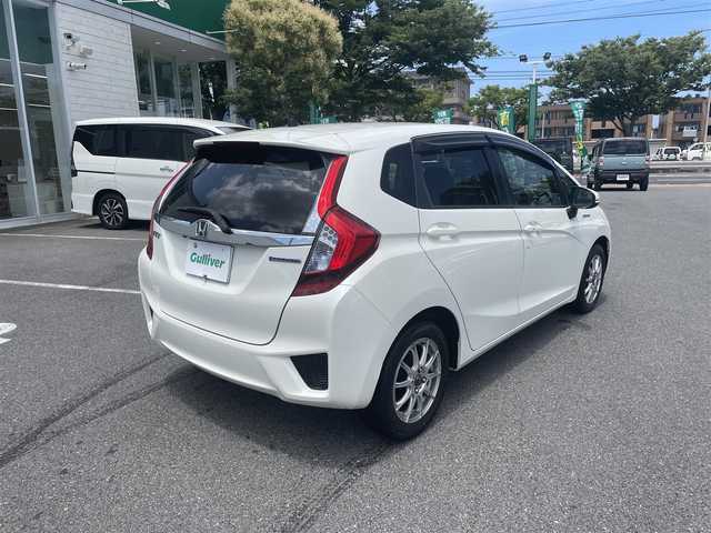 ホンダ フィット ハイブリット Lパッケージ 鳥取県 2013(平25)年 14.1万km プレミアムホワイトパール HONDAインターナビ/・フルセグ/・Bluetooth/・HDMI/バックカメラ/スマートキー/プッシュスタート/ビルトインETC/クルーズコントロール/タッチパネルAAC/ハーフレザーシート/社外15AW/オートライト/LEDヘッドライト/ABS/Wエアバック/サイドエアバック /カーテンエアバック