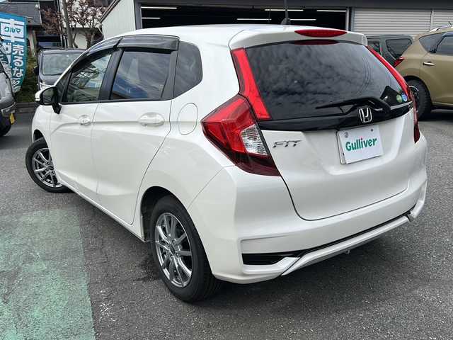 ホンダ フィット 13G L ホンダセンシング 埼玉県 2018(平30)年 5.4万km プレミアムホワイトパールⅡ ホンダセンシング/ ・衝突軽減ブレーキ/ ・誤発進抑制機能/ ・車線維持支援システム/ ・先行車発進お知らせ機能/ ・標識認識機能/純正メモリーナビゲーション(VXM-184VFi)/(AM/FM/CD/DVD/BT/USB/フルセグＴＶ)/バックカメラ/社外前後ドライブレコーダー(DRY-TW7550d)/ビルトインＥＴＣ/追従型クルーズコントロール/ＬＥＤヘッドライト/オートライト/フォグランプ/純正フロアマット/ドアバイザー/スペアキー１ヶ/保証書