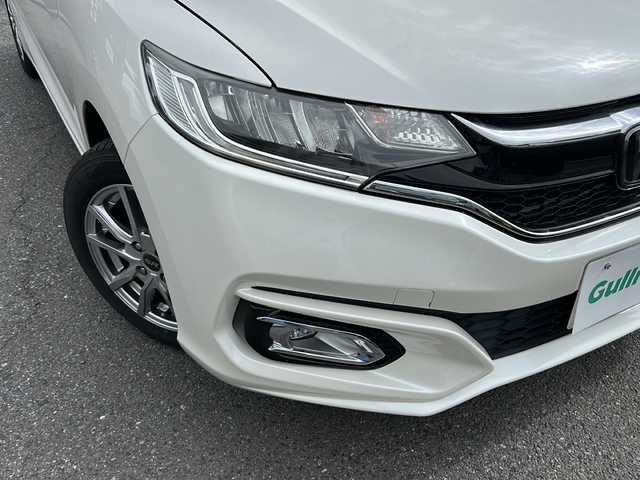 ホンダ フィット 13G L ホンダセンシング 埼玉県 2018(平30)年 5.4万km プレミアムホワイトパールⅡ ホンダセンシング/ ・衝突軽減ブレーキ/ ・誤発進抑制機能/ ・車線維持支援システム/ ・先行車発進お知らせ機能/ ・標識認識機能/純正メモリーナビゲーション(VXM-184VFi)/(AM/FM/CD/DVD/BT/USB/フルセグＴＶ)/バックカメラ/社外前後ドライブレコーダー(DRY-TW7550d)/ビルトインＥＴＣ/追従型クルーズコントロール/ＬＥＤヘッドライト/オートライト/フォグランプ/純正フロアマット/ドアバイザー/スペアキー１ヶ/保証書