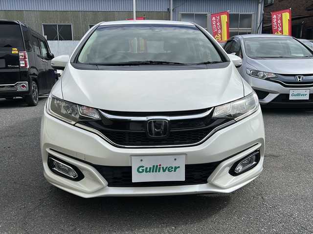 ホンダ フィット 13G L ホンダセンシング 埼玉県 2018(平30)年 5.4万km プレミアムホワイトパールⅡ ホンダセンシング/ ・衝突軽減ブレーキ/ ・誤発進抑制機能/ ・車線維持支援システム/ ・先行車発進お知らせ機能/ ・標識認識機能/純正メモリーナビゲーション(VXM-184VFi)/(AM/FM/CD/DVD/BT/USB/フルセグＴＶ)/バックカメラ/社外前後ドライブレコーダー(DRY-TW7550d)/ビルトインＥＴＣ/追従型クルーズコントロール/ＬＥＤヘッドライト/オートライト/フォグランプ/純正フロアマット/ドアバイザー/スペアキー１ヶ/保証書