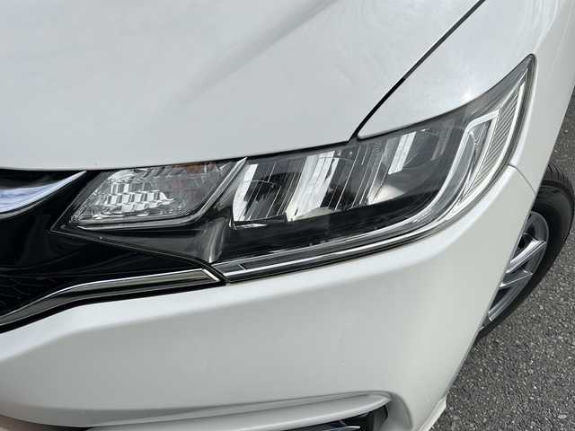 ホンダ フィット 13G L ホンダセンシング 埼玉県 2018(平30)年 5.4万km プレミアムホワイトパールⅡ ホンダセンシング/ ・衝突軽減ブレーキ/ ・誤発進抑制機能/ ・車線維持支援システム/ ・先行車発進お知らせ機能/ ・標識認識機能/純正メモリーナビゲーション(VXM-184VFi)/(AM/FM/CD/DVD/BT/USB/フルセグＴＶ)/バックカメラ/社外前後ドライブレコーダー(DRY-TW7550d)/ビルトインＥＴＣ/追従型クルーズコントロール/ＬＥＤヘッドライト/オートライト/フォグランプ/純正フロアマット/ドアバイザー/スペアキー１ヶ/保証書