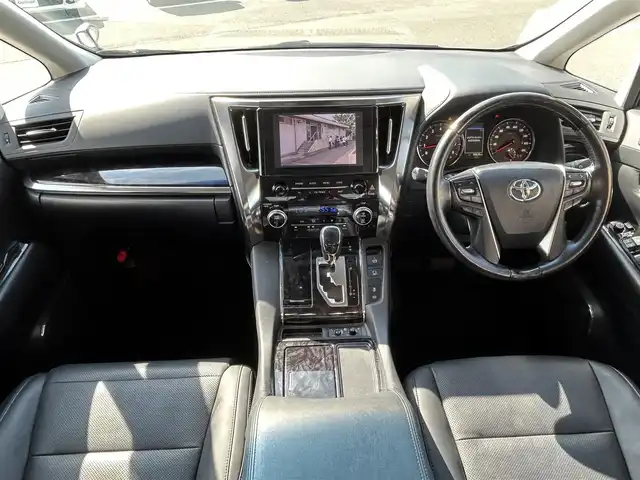 トヨタ アルファード S Cパッケージ 愛媛県 2021(令3)年 3.1万km ホワイトパールクリスタルシャイン Wサンルーフ/純正9型ナビ(AM/FM/CD/DVD/BT/フルセグTV)/純正12型フリップダウンモニター/両側電動パワースライドドア/バックカメラ/黒革シート/前席パワーシート/シートヒーター/シートベンチレーション/シートメモリー機能/トヨタセーフティセンス/レーダークルーズコントロール/衝突被害軽減装置/車線逸脱防止装置/クリアランスソナー/ステアリングヒーター/電動リアゲート/ETC/3眼LEDヘッドライト/電動パーキングブレーキ/Autohold機能/ステアリングリモコン/現状サマー(純正AW)(235/50/R18)/TOYOTIRES TRANPATH MP7