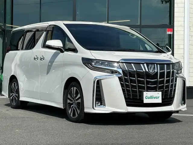 トヨタ アルファード S Cパッケージ 愛媛県 2021(令3)年 3.1万km ホワイトパールクリスタルシャイン Wサンルーフ/純正9型ナビ(AM/FM/CD/DVD/BT/フルセグTV)/純正12型フリップダウンモニター/両側電動パワースライドドア/バックカメラ/黒革シート/前席パワーシート/シートヒーター/シートベンチレーション/シートメモリー機能/トヨタセーフティセンス/レーダークルーズコントロール/衝突被害軽減装置/車線逸脱防止装置/クリアランスソナー/ステアリングヒーター/電動リアゲート/ETC/3眼LEDヘッドライト/電動パーキングブレーキ/Autohold機能/ステアリングリモコン/現状サマー(純正AW)(235/50/R18)/TOYOTIRES TRANPATH MP7