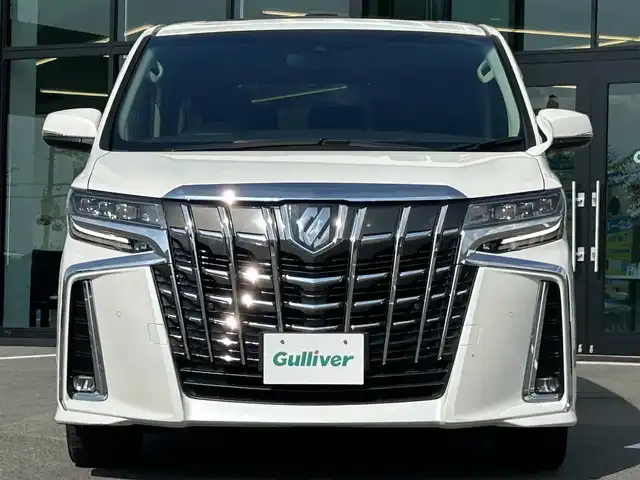 トヨタ アルファード S Cパッケージ 愛媛県 2021(令3)年 3.1万km ホワイトパールクリスタルシャイン Wサンルーフ/純正9型ナビ(AM/FM/CD/DVD/BT/フルセグTV)/純正12型フリップダウンモニター/両側電動パワースライドドア/バックカメラ/黒革シート/前席パワーシート/シートヒーター/シートベンチレーション/シートメモリー機能/トヨタセーフティセンス/レーダークルーズコントロール/衝突被害軽減装置/車線逸脱防止装置/クリアランスソナー/ステアリングヒーター/電動リアゲート/ETC/3眼LEDヘッドライト/電動パーキングブレーキ/Autohold機能/ステアリングリモコン/現状サマー(純正AW)(235/50/R18)/TOYOTIRES TRANPATH MP7