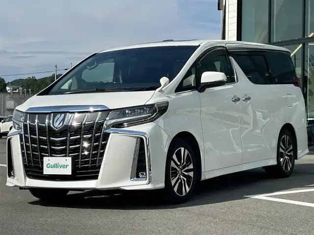 トヨタ アルファード S Cパッケージ 愛媛県 2021(令3)年 3.1万km ホワイトパールクリスタルシャイン Wサンルーフ/純正9型ナビ(AM/FM/CD/DVD/BT/フルセグTV)/純正12型フリップダウンモニター/両側電動パワースライドドア/バックカメラ/黒革シート/前席パワーシート/シートヒーター/シートベンチレーション/シートメモリー機能/トヨタセーフティセンス/レーダークルーズコントロール/衝突被害軽減装置/車線逸脱防止装置/クリアランスソナー/ステアリングヒーター/電動リアゲート/ETC/3眼LEDヘッドライト/電動パーキングブレーキ/Autohold機能/ステアリングリモコン/現状サマー(純正AW)(235/50/R18)/TOYOTIRES TRANPATH MP7