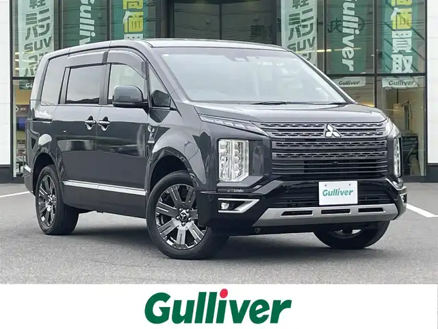三菱 デリカＤ：５ ジャスパー 岡山県 2023(令5)年 1.8万km グラファイトグレーメタリック/ブラックマイカ 登録時走行距離17248km/純正10.1インチナビ/フルセグTV(AM.FM.CD.DVD.TV.BT)/両側パワースライドドア/全方位カメラ/ETC/ブラインドスポットモニター/ドライブレコーダー/シートヒーター/ブラックレザー調シートカバー/純正ハーフレザーシート/D席パワーシート/衝突軽減ブレーキ/横滑り防止装置/レーダークルーズコントロール/レーンキープアシスト/オートライト/オートマチックハイビーム/アイドリングストップ/電動リアゲート/18インチ純正AW/フロアマット】