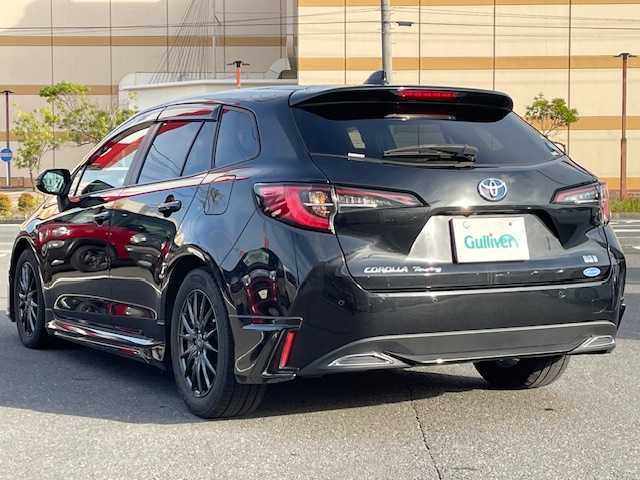 トヨタ カローラツーリング ハイブリッド ダブルバイビー 宮城県 2021(令3)年 12.6万km ブラックマイカ 登録時走行距離125874km/純正ナビ/TV・Bluetooth・AM・FM・ミラキャスト/バックカメラ/シートヒーター/モデリスタエアロ/寒冷地仕様/純正ビルトインETC/コーナーセンサー/電動パーキングシステム/オートマチックハイビーム/ステアリングヒーター/レーザー探知機/プッシュスタート/ドアバイザー/電動格納ミラー