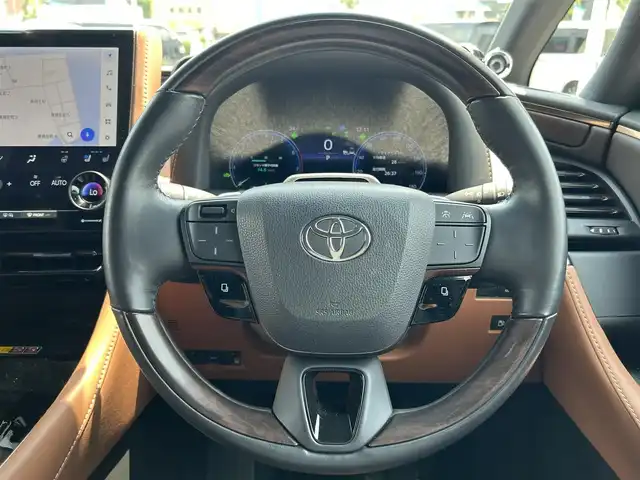 トヨタ ヴェルファイア ハイブリット Z プレミア 愛媛県 2023(令5)年 5.4万km ブラック 登録時走行距離：53925Km/メーカーオプション純正14インチHDナビ/AM/FM/フルセグTV/Bluetooth/ヘッドアップディスプレイ/ムーンルーフ/バックサイドカメラ/ワイヤレス充電/前後ドライブレコーダー/横滑り防止装置/パーキングアシスト/LEDヘッドライト/オートライト/オートハイビーム/フォグランプ/エンジンスタートボタン/シートヒーター/スマートキー/純正アルミホイール/純正フロアマット/シートーヒーター/シートメモリ