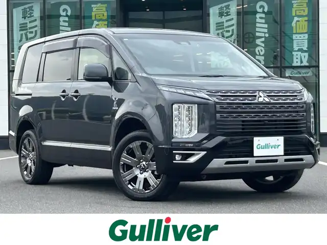 三菱 デリカＤ：５ ジャスパー 岡山県 2023(令5)年 1.8万km グラファイトグレーメタリック/ブラックマイカ 登録時走行距離17486km/純正10.1インチナビ/フルセグTV(AM.FM.CD.DVD.TV.BT)/両側パワースライドドア/全方位カメラ/ETC/ブラインドスポットモニター/ドライブレコーダー/シートヒーター/ブラックレザー調シートカバー/純正ハーフレザーシート/D席パワーシート/衝突軽減ブレーキ/横滑り防止装置/レーダークルーズコントロール/レーンキープアシスト/オートライト/オートマチックハイビーム/アイドリングストップ/電動リアゲート/18インチ純正AW/フロアマット