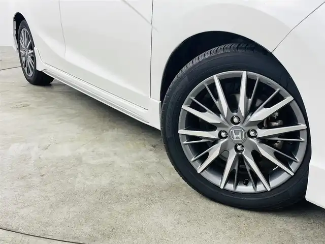 ホンダ シャトル ハイブリッド Z ホンダセンシング 福島県 2022(令4)年 6.5万km プラチナホワイトパール ホンダセンシング/・衝突軽減ブレーキ（CMBS）/・誤発進抑制機能/・路外逸脱抑制機能/・アダプティブクルーズコントロール（ACC）/・車線維持支援システム（LKAS）/・先行車発進お知らせ機能/・標識認識機能/純正ナビ：VXM-215VFEi/・フルセグ/BT/CD/DVD/SD/FM/AM/USB/・バックカメラ/・ビルトインETC/社外前後ドライブレコーダー/革巻きステアリング/・ステアリングスイッチ/・パドルシフト/ハーフレザーシート/・シートヒーター/LEDヘッドライト/・LEDフォグランプ/・オートライト/電動格納ミラー/・ウィンカーミラー/純正フロアマット/ドアバイザー/スマートキー/・プッシュスタート